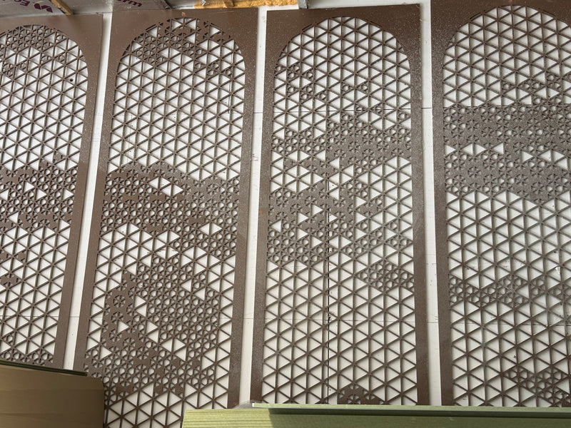 Decorative geometric wall panels with an intricate triangular lattice pattern, shown installed in a series of four vertical sections.
